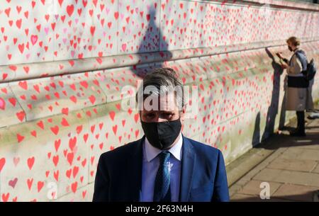 LONDON, UK. MARCH 29TH: Labour Leader Keir Starmer Visits The National Covid-19 Memorial Wall on London's South Bank opposite The Houses of Parliament, each red heart represents one of the 150,000 victims who have died during the Pandemic pictured on Monday 29th March 2021. (Credit: Lucy North | MI News) Credit: MI News & Sport /Alamy Live News Stock Photo