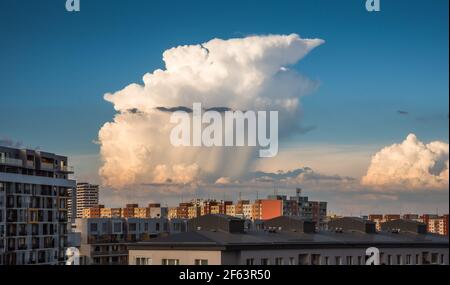 Big Cumulonimbus Cloud over Residential Buildings of Petrzalka Suburb in Bratislava, Slovakia Stock Photo