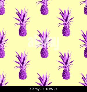 Seamless pattern of pink pineapples isolated on yellow background. Exotic tropical fruit Stock Photo
