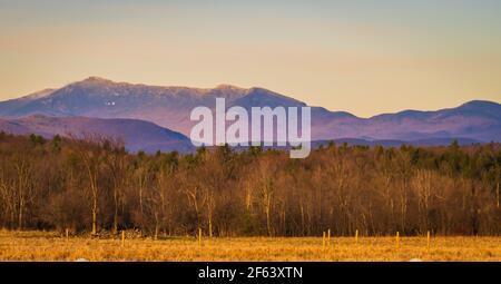 evening sun lights up Mount Mansfield in late winter along  the Vermont Green Mountains Stock Photo