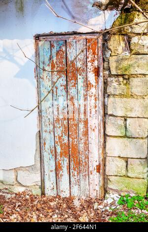 Wooden door part of demolition brick wall Stock Photo
