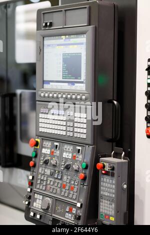 Control panel of CNC lathe machine close up. Selective focus. Stock Photo