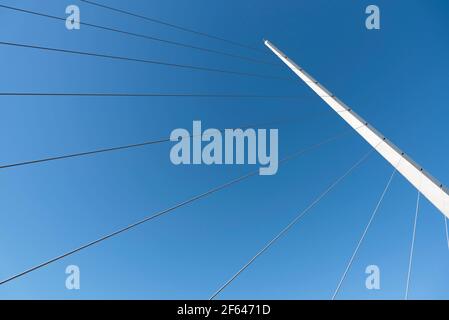 Mast and cables of the Puente de la Mujer, a modern rotating footbridge located in Puerto Madero, Buenos Aires, Argentina. Stock Photo