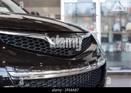 Russia, Izhevsk - February 17, 2021: Haval logo on a bumper of new car at dealership showroom. Car manufacturer from China. Modern transportation. Stock Photo