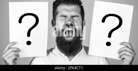 Male with emotion scream, question marks. Screaming man. Getting answers, scream. Question mark, symbol. Concept - challenging issue, looking for the Stock Photo