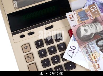 Old fashioned calculator dollars and pounds, isolated on white Stock Photo