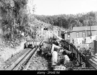 Coal wagons on the railway incline at the entrance to Dunollie coal mine, New Zealand, circa 1910. Photo by Muir Moodie of Dunedin Stock Photo