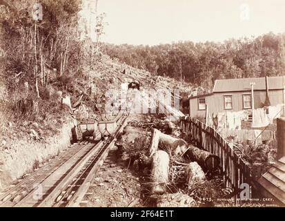 Coal wagons on the railway incline at the entrance to Dunollie coal mine, New Zealand, circa 1910. Photo by Muir Moodie of Dunedin Stock Photo