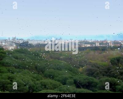 Blurred landscape. It's seen from a window with raindrops on it Stock Photo