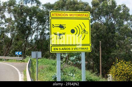 Sign on accident hotspot on country road in Spain warning that drones, speed cameras and helicopters are in use. Stock Photo