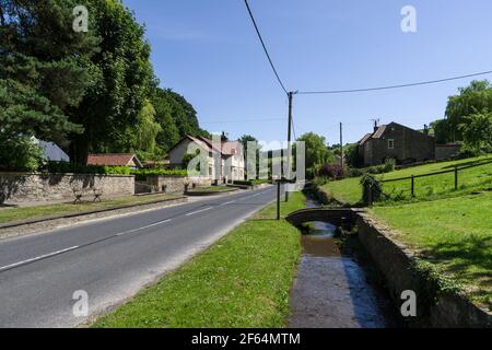 Street scene in summer in the pretty village of Gilling East, Yorkshire, UK Stock Photo