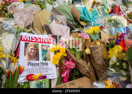 Clapham Common, London - shortly after the vigil and arrests by the poice, calmness prevails where flowers are laid in memory of Sarah Everard. Stock Photo