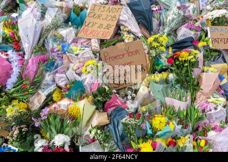 Clapham Common, London - shortly after the vigil and arrests by the poice, calmness prevails where flowers are laid in memory of Sarah Everard. Stock Photo