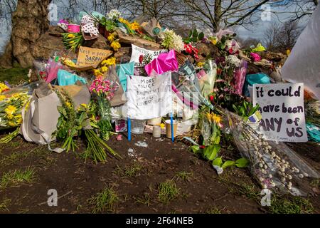 Clapham Common, London - shortly after the vigil and arrests by the poice, calmness prevails where flowers are laid in memory of Sarah Everard. Stock Photo