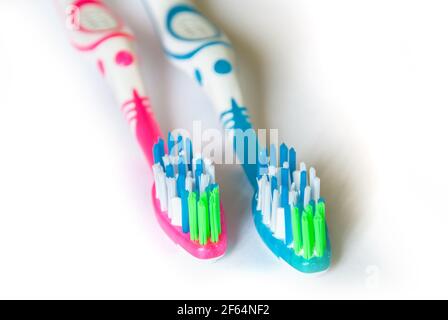 Two toothbrushes isolated on white background closeup Stock Photo