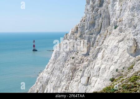Beachy Head Lighthouse, located in the English Channel sits below Beachy Head, highest chalk sea cliff in Britain. East Sussex. UK. Stock Photo