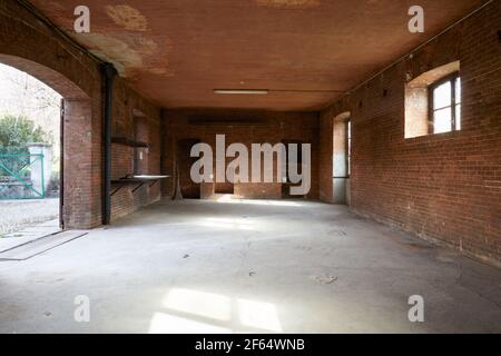 Old, empty workshop interior with brick walls Stock Photo