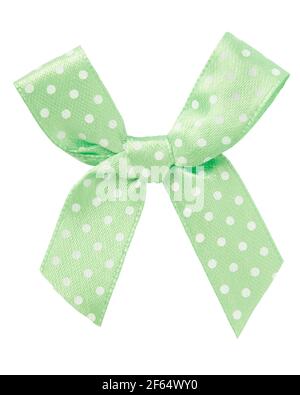 Pale green bow with white dots isolated on white, clipping path Stock Photo