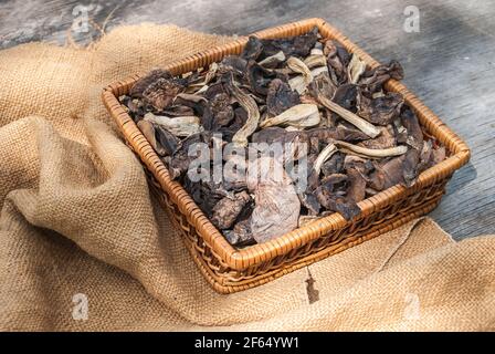 dried mushrooms, on a wooden table Stock Photo