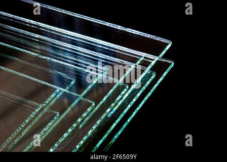 Sheets of Factory manufacturing tempered clear float glass panels cut to size. Stock Photo