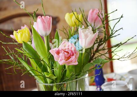 tulips in a vase, festive table, Easter Stock Photo
