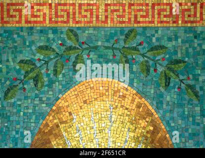 colorful ceramic mosaic on the wall made up of brightly colored tiles,representation of the rising of the sun. Stock Photo