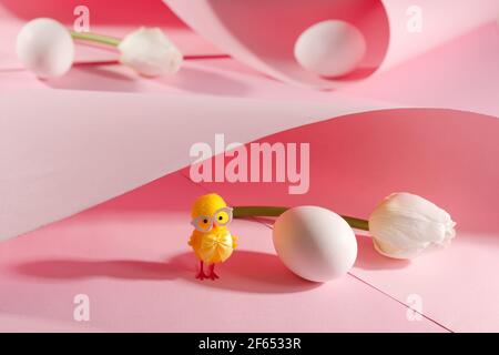 White egg with easter chicken on pink background. Easter spring holiday card Stock Photo