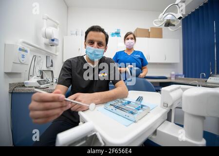 Glasgow, Scotland, UK. 30th Mar, 2021. PICTURED: Anas Sarwar MSP - Leader of the Scottish Labour Party seen visiting a dentist practice on the Holyrood Election campaign trail. Credit: Colin Fisher/Alamy Live News Stock Photo