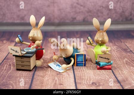 Seiffen, Germany. 10th Mar, 2021. The Erzgebirgische folk art discovers Corona for itself and develops around the topic products. The Stupsi bunnies in the home office from the company Kuhnert should now convince at Easter. All three bunnies are available. Credit: Nico Schimmelpfennig/dpa-Zentralbild/ZB/dpa/Ģ����ý Live News Stock Photo
