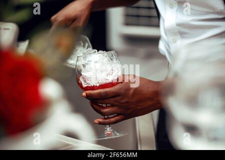 Bartender White Shirt Adding Transparent Red Alcoholic Drink Measuring Cup  Stock Photo by ©Fesenko 199284042