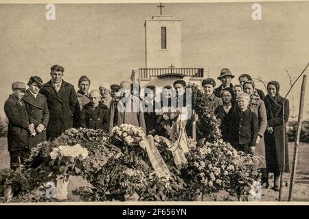 Latvia - CIRCA 1930s: People at funeral ceremony. Group photo in cemetery. Vintage archive Art deco era photo Stock Photo