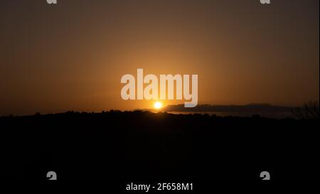 Sunset at clear weather in Aegean Skies Stock Photo
