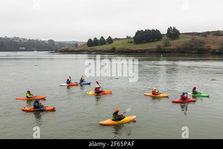 Kinsale, Cork, Ireland. 30th March, 2021. A group of Kayakers out for a morning paddle in Kinsale, Co. Cork, Ireland. - Credit; David Creedon / Alamy Live News Stock Photo