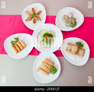 Different various kinds of dim sum including dumplings traditional Chinese food. Stock Photo