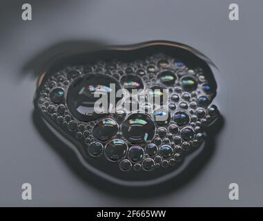 A soap bubble in a washing up bowl close-up Stock Photo