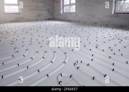 water underfloor heating system installation in the new building Stock Photo