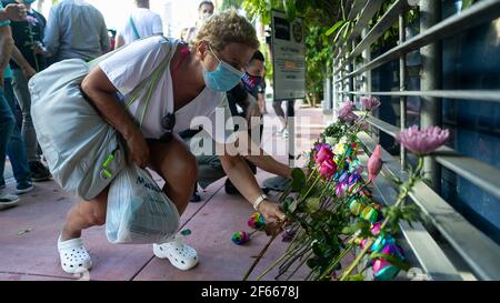 Miami, USA. 26th Mar, 2021. People place flowers during a vigil for Christine Englehardt outside of the Albion Hotel in South Beach, Florida on Friday, March 26, 2021. Englehardt, 24, died at the hotel after police say two spring breakers drugged and raped her. (Photo by Matias J. Ocner/Miami Herald/TNS/Sipa USA) Credit: Sipa USA/Alamy Live News Stock Photo