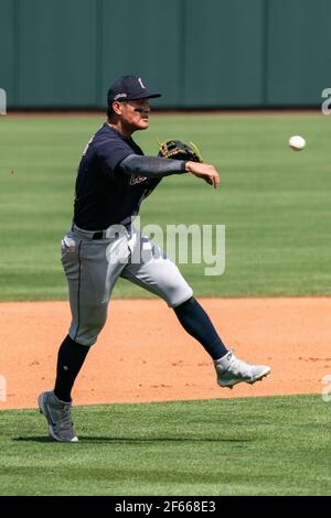 Cleveland Indians shortstop Yu Chang (2) throws to first base during a spring training game against the Kansas City Royals, Sunday, March 29, 2021, in Stock Photo