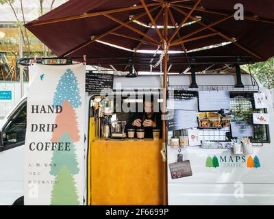 Tokyo, Japan - Coffee truck located at Marunouchi, one of the most important business district in the city. The smallest cafe for office workers. Stock Photo