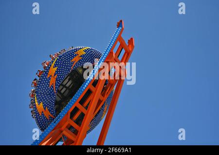 Landscape with scenic view of people on the Shockwave, a wild ride at the Santa Cruz Amusement Park in California, USA. Stock Photo