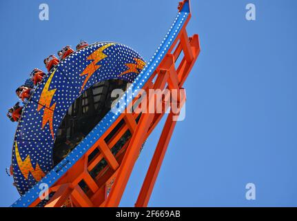 Landscape with scenic view of people on the Shockwave, a wild ride at the Santa Cruz Amusement Park in California, USA. Stock Photo