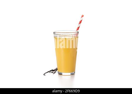 Delicious vanilla milkshake in glass isolated on white background. Stock Photo