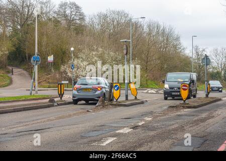 Traffic calming measures designed to slow traffic down on Norcot Road in Reading, UK. The road is full of potholes and in need of repair. Stock Photo