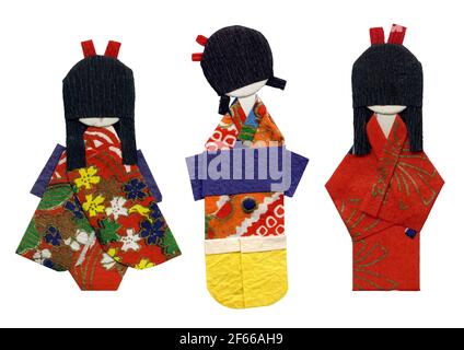 Set of three origami geishas - handmade flat paper dolls isolated on white Stock Photo