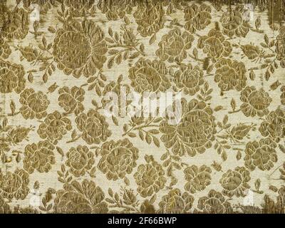 Antique fabric wallpaper embroidered with gold thread, floral pattern with rose motif Stock Photo