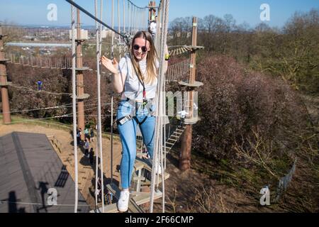 Climbers enjoy the warm weather at Go Ape at Alexandra Palace, in north London. Picture date: Thursday March 18, 2021. Temperatures in parts of the UK are expected to be significantly warmer this week as families and friends are reunited and sporting activities are allowed to resume in England following the relaxation of coronavirus restrictions.