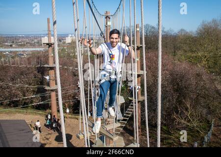 Climbers enjoy the warm weather at Go Ape at Alexandra Palace, in north London. Picture date: Thursday March 18, 2021. Temperatures in parts of the UK are expected to be significantly warmer this week as families and friends are reunited and sporting activities are allowed to resume in England following the relaxation of coronavirus restrictions.