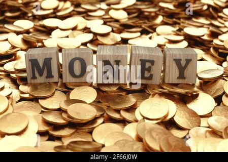 Money written on a wooden blocks, coins and bills. Business and career concept. 3d rendering Stock Photo