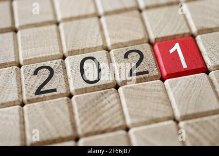 Set of wooden blocks in strict order with 2021 sign on them Stock Photo
