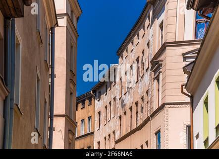 A low angle shot of neglected and dilapidated old tenement buildings in Torun, Poland Stock Photo